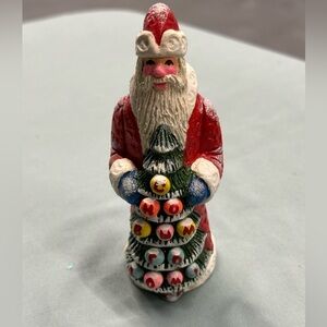 Resin Santa figure carries a special greeting